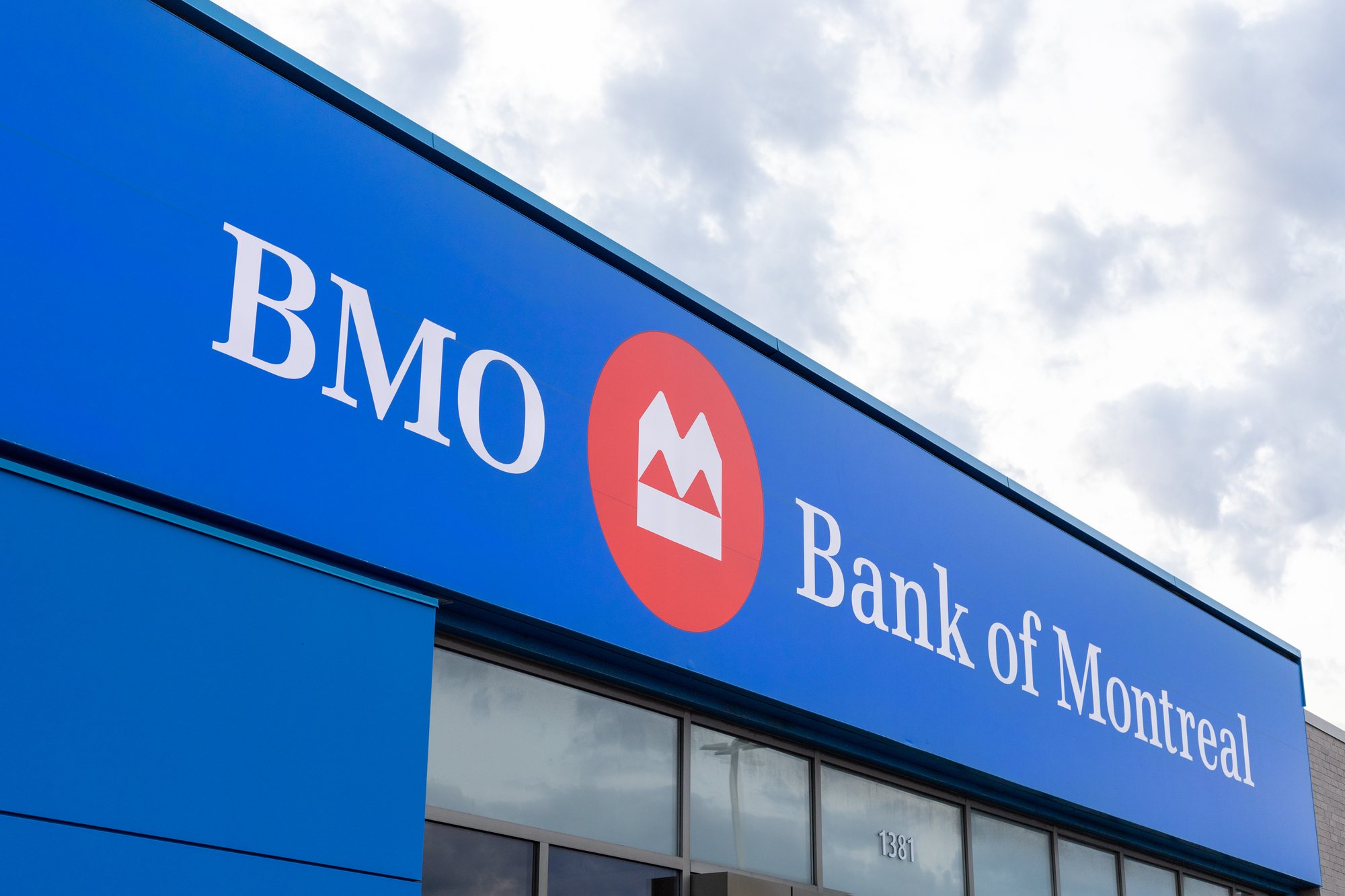 Flags fly atop a Bank of Montreal (BMO) building - BMO trust
