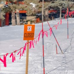 A closed sign regarding the ski pass refund class action lawsuit filed