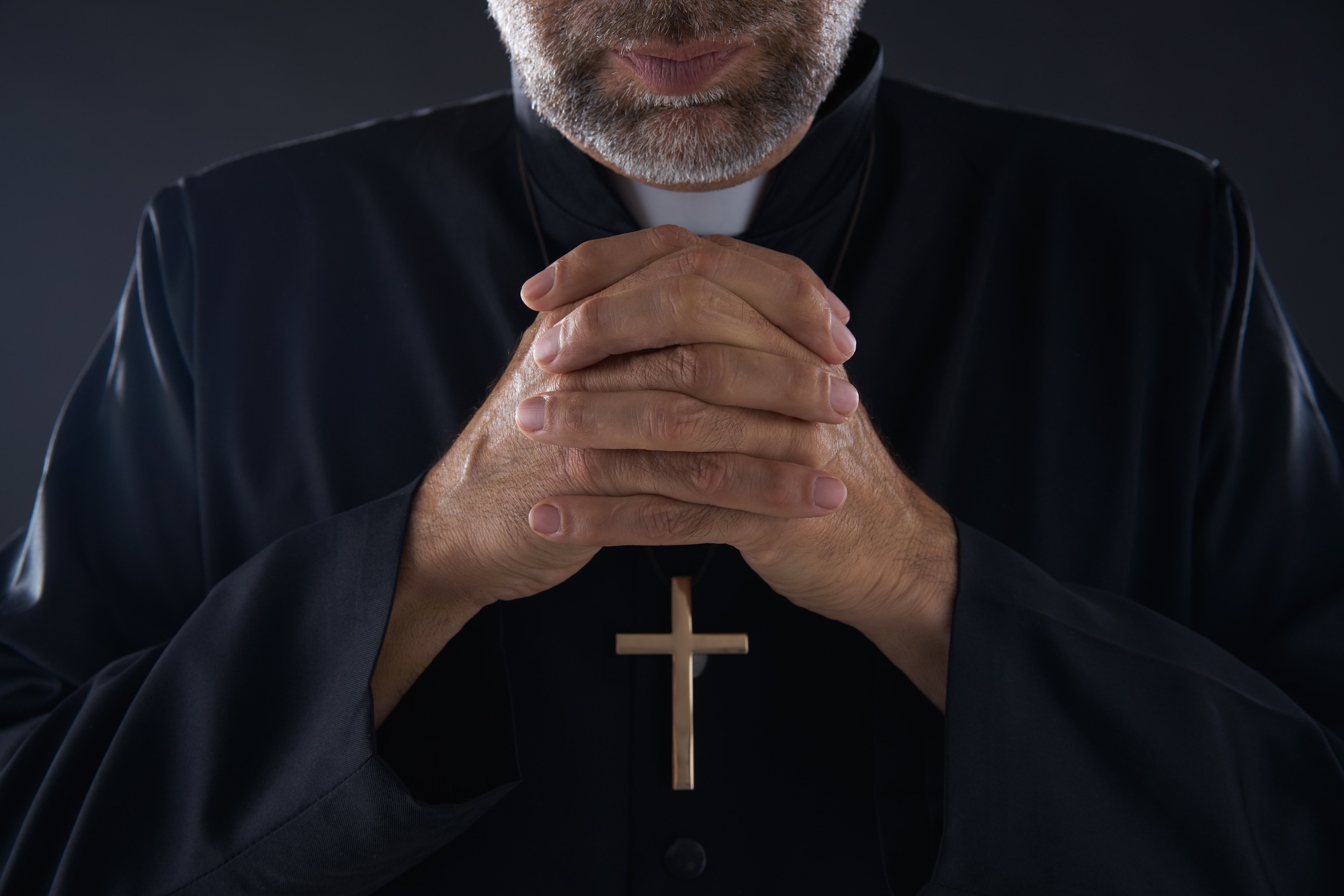 Cropped shot of a priest regarding the Archdiocese of Vancouver class action lawsuit