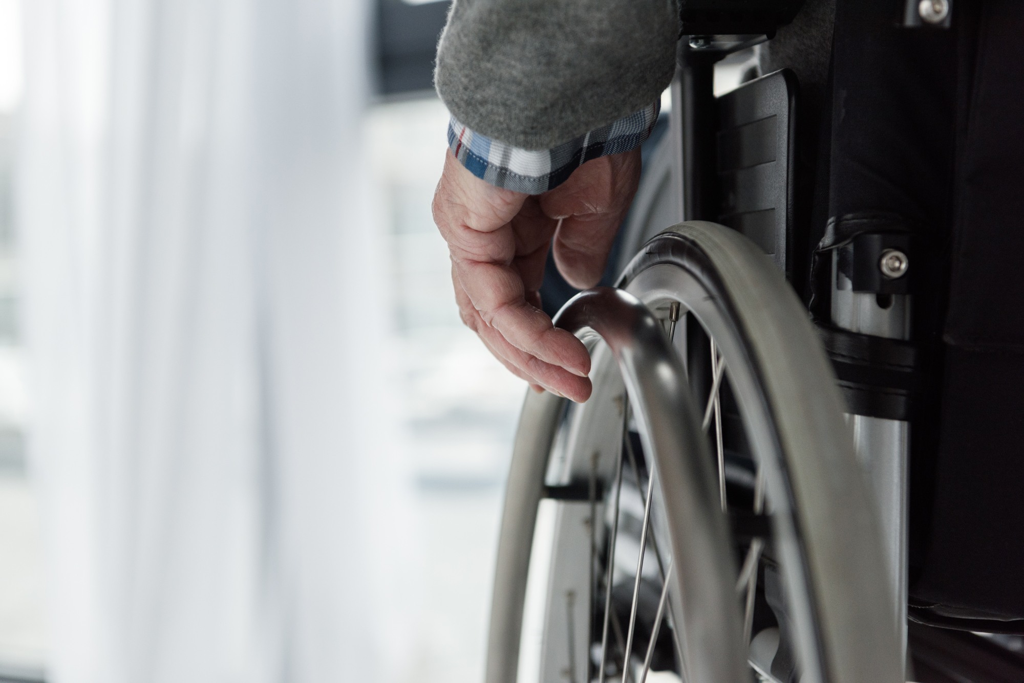 Senior in wheelchair regarding Canada's largest COVID-19 lawsuit naming Extendicare 