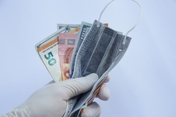 money and face masks regarding the COVID-19 price-gouging class action lawsuit filed in Canada