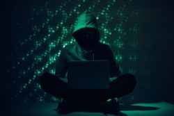 Hacker using laptop