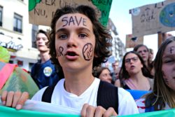 Kid protesting climate change regarding the climate change lawsuit Canada