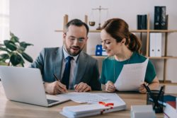 Lawyer helping client regarding information on how to hire a long-term disability lawyer