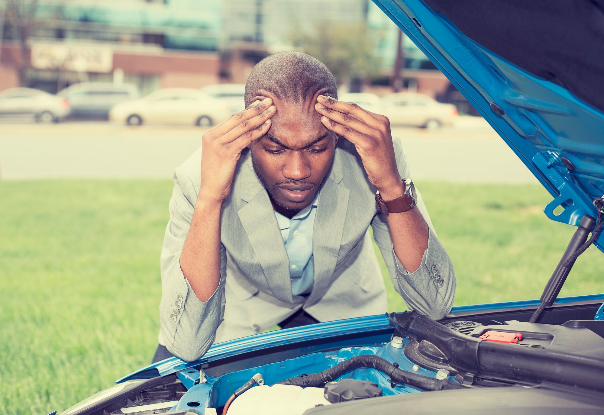 Stressed out man having truck issues regarding the Dodge Ram 1500 class action lawsuit