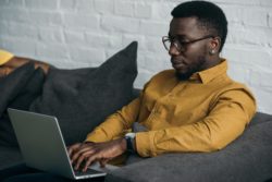 Man using laptop regarding the Google incognito mode class action lawsuit in Canada