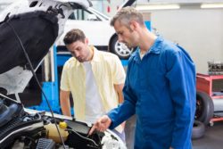 Man with mechanic regarding the Hyundai settlement