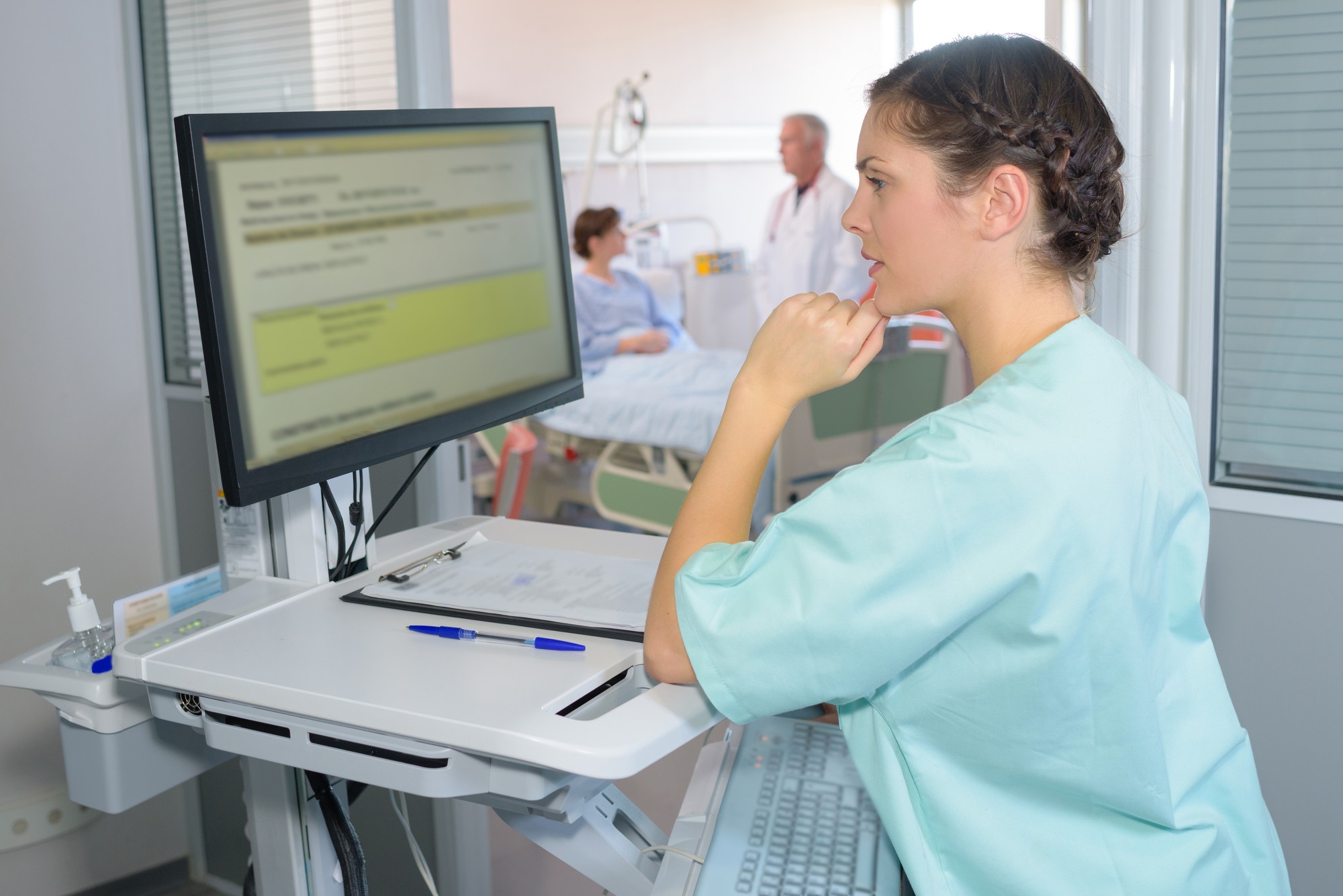 Nurse looking at patient info regarding the Central Health class action lawsuit to be filed