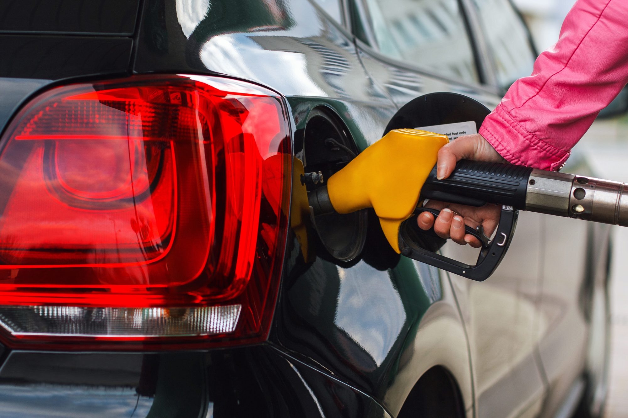 Person filling up car regarding the B.C. gas prices class action lawsuit