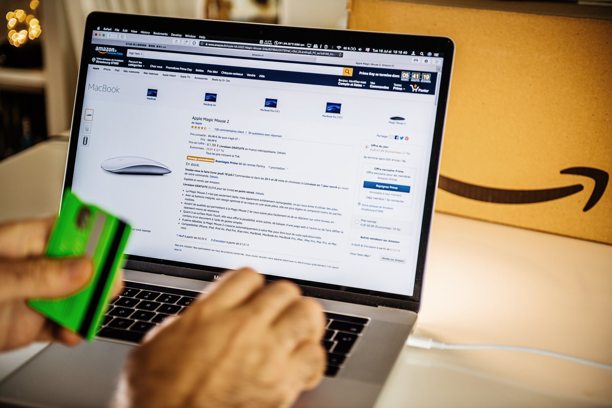 Person shopping on Amazon website on laptop regarding the Amazon price fixing class action lawsuit filed