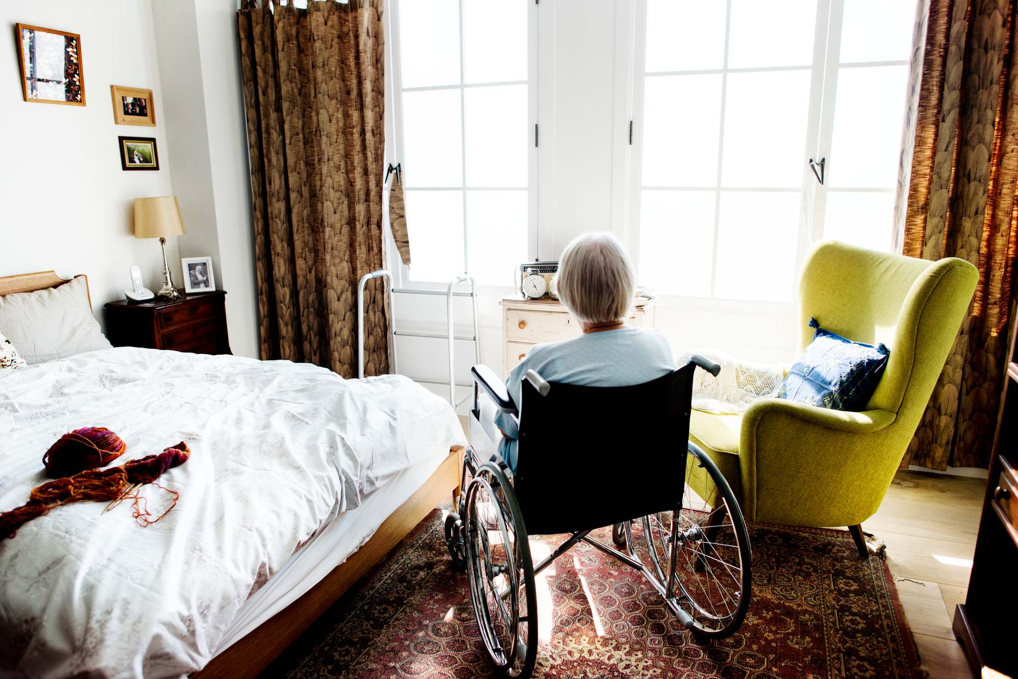 Senior woman sitting in wheelchair regarding the Orchard villa longterm-car home class action lawsuit filed amid COVID-19 deaths