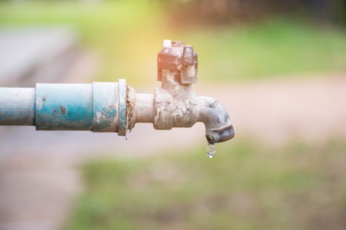 water drop in tap,Leaking water.