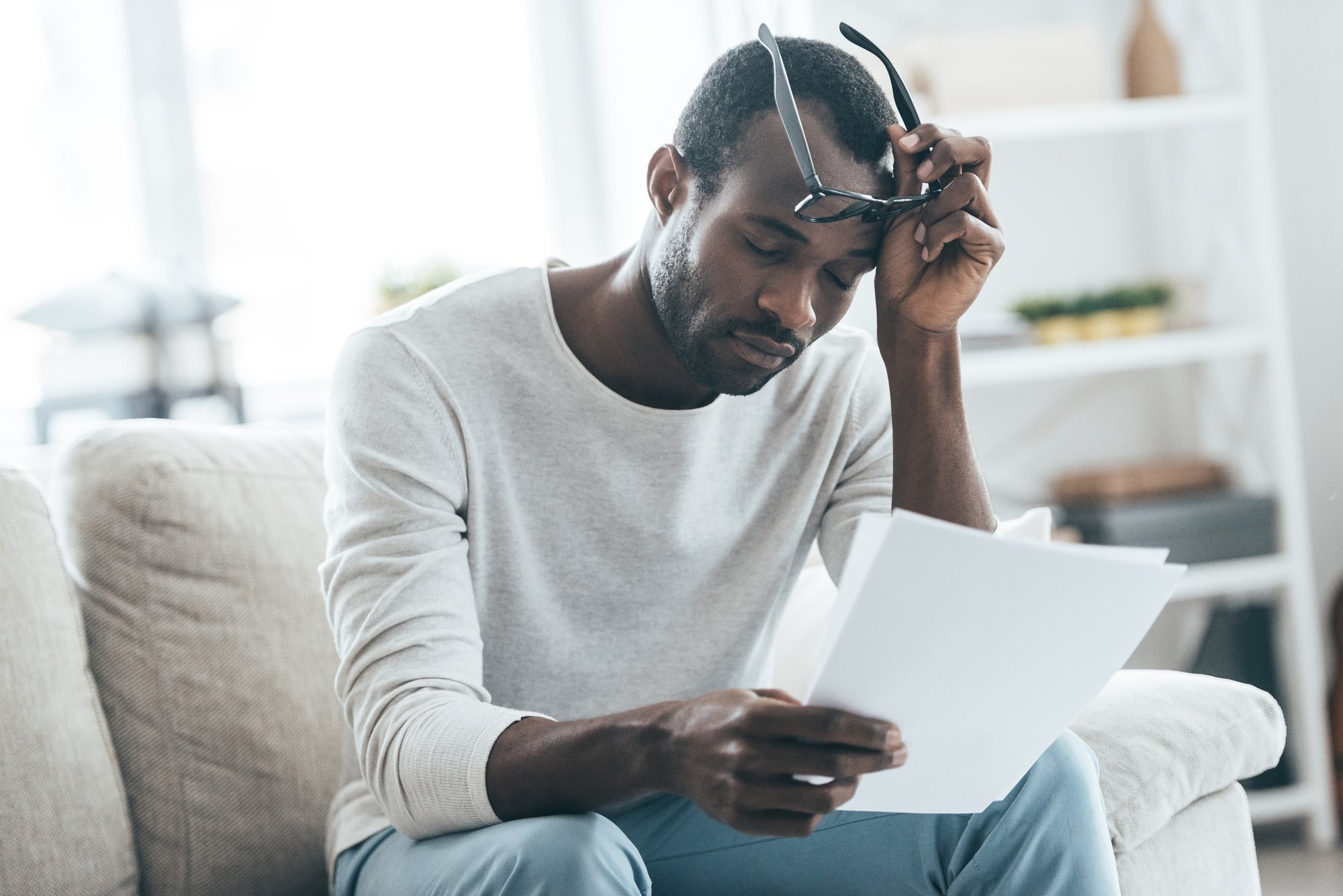 upset man with denial letter regarding information on what to do if your Sun Life long-term disability claim is denied