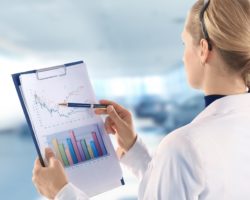 Woman analyzing graph regarding the stableview class action lawsuit 