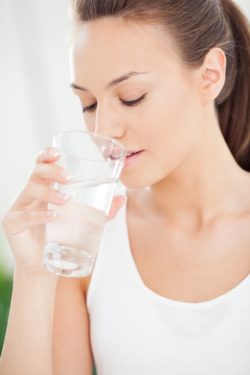 First Nations woman drinking tap water amid claims of unsafe drinking water