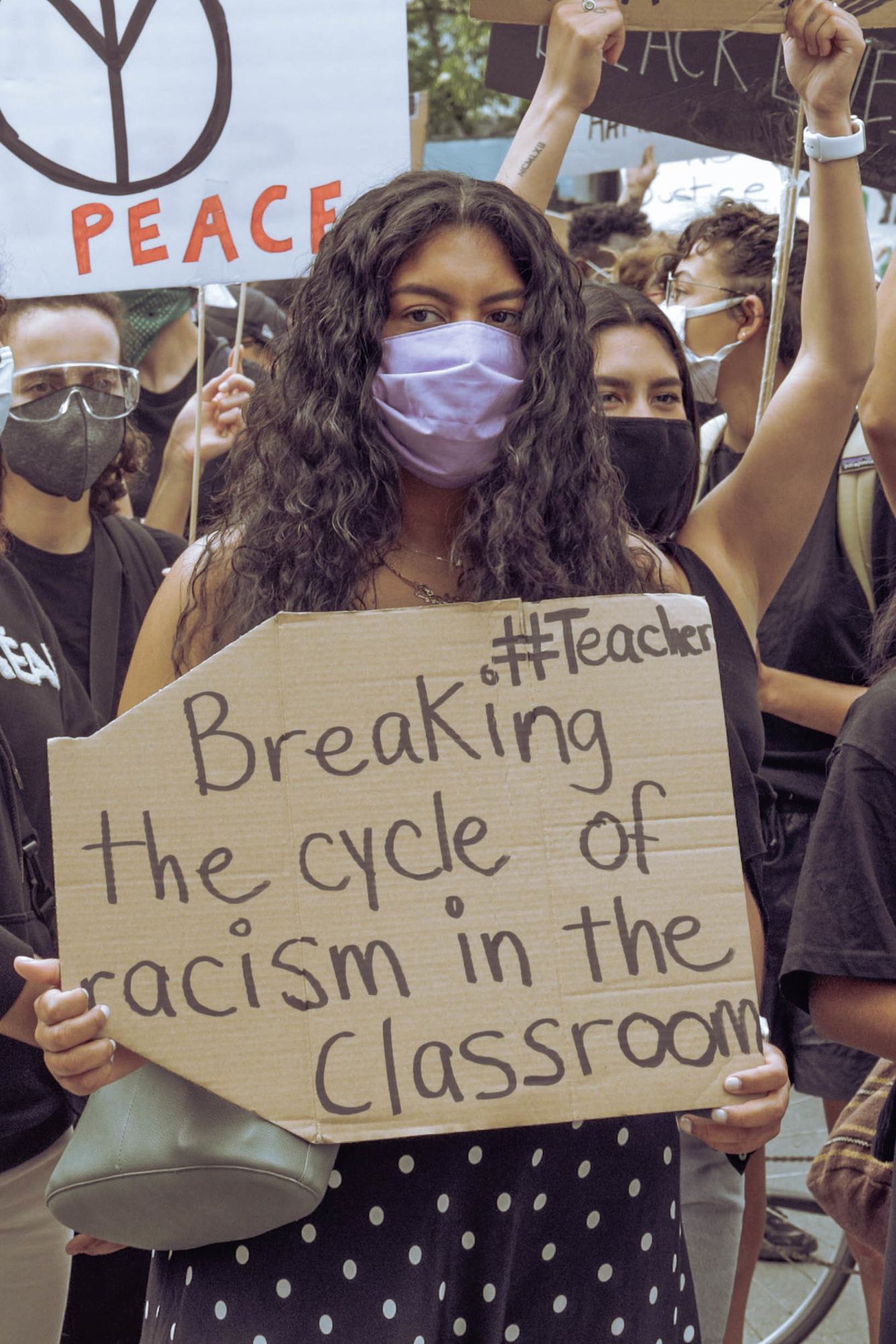 Teacher protesting racism regarding the Scholar Strike Canada