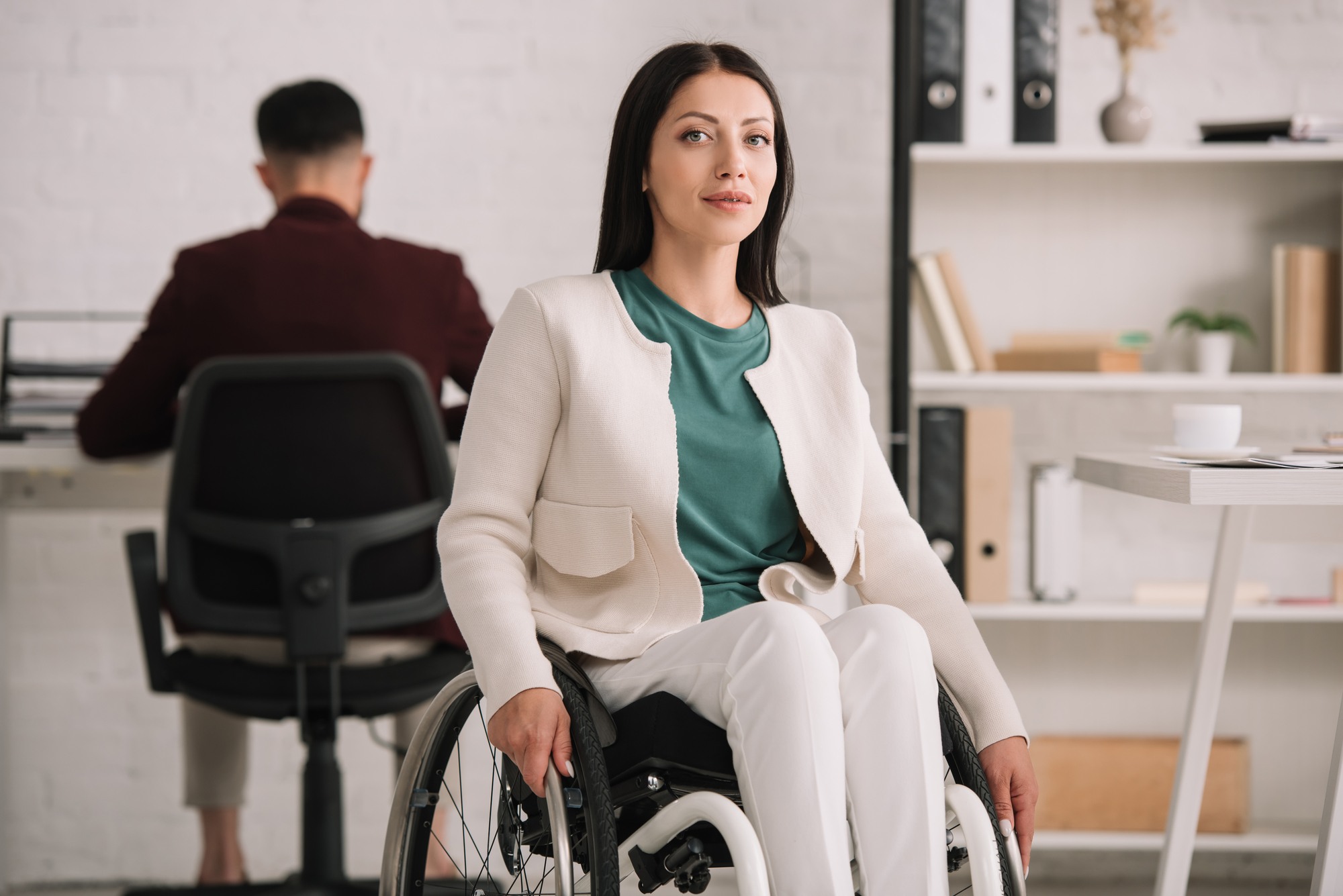 Woman in wheelchair regarding information on long term disability in Canada