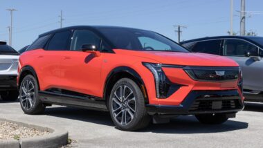 Cadillac OPTIQ Sport 1 Electric SUV at a dealership.
